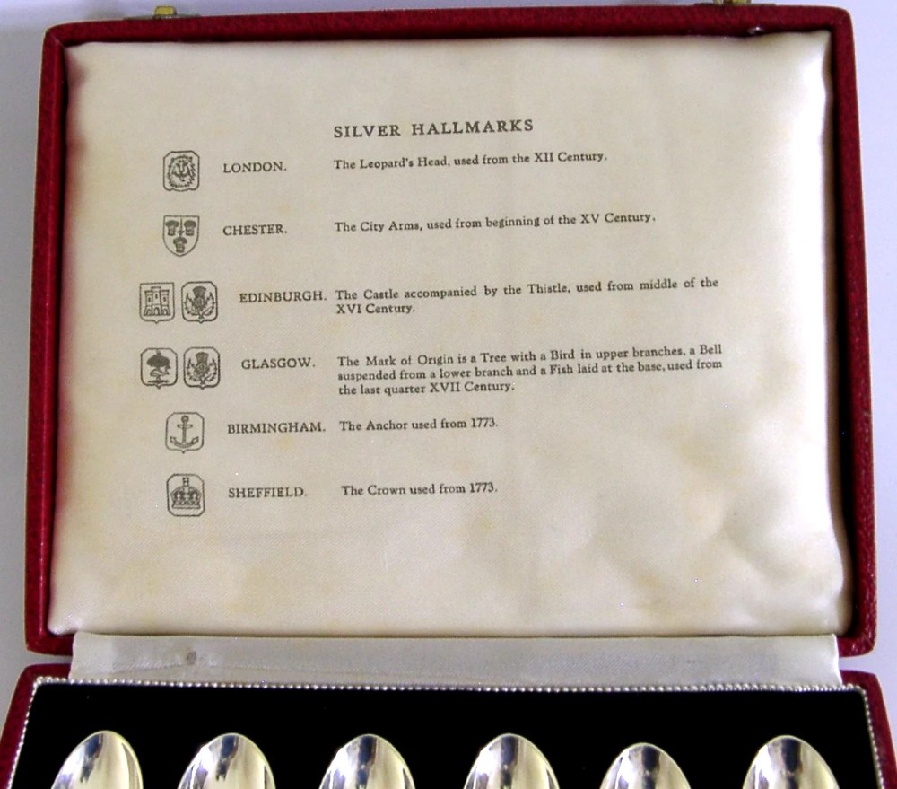 A set of six sterling silver teaspoons presented inside a fitted red velvet presentation box. View IV