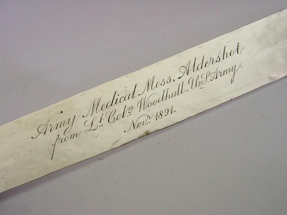 An engraved Victorian sterling silver page turner featuring script inscriptions along its flat blade. View II