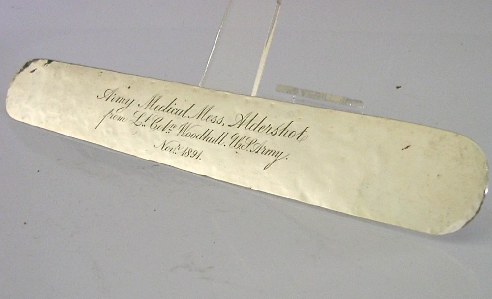 An engraved Victorian sterling silver page turner featuring script inscriptions along its flat blade. View III