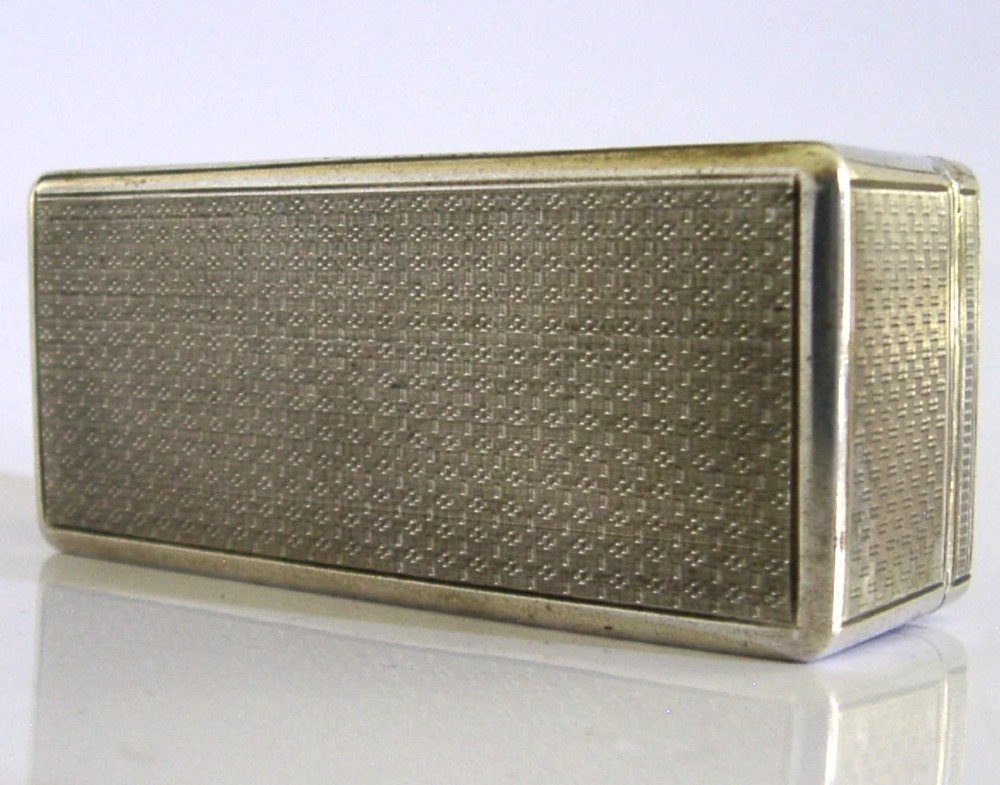 An antique rectangular Austro-Hungarian solid silver box featuring intricate engraved scrollwork and an open hinged lid displaying a gilt interior. View IX