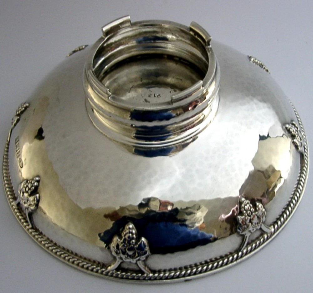 A hand-hammered sterling silver footed tazza featuring applied grape and vine motifs along the rim. View II
