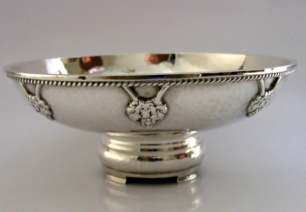 A hand-hammered sterling silver footed tazza featuring applied grape and vine motifs along the rim. View III