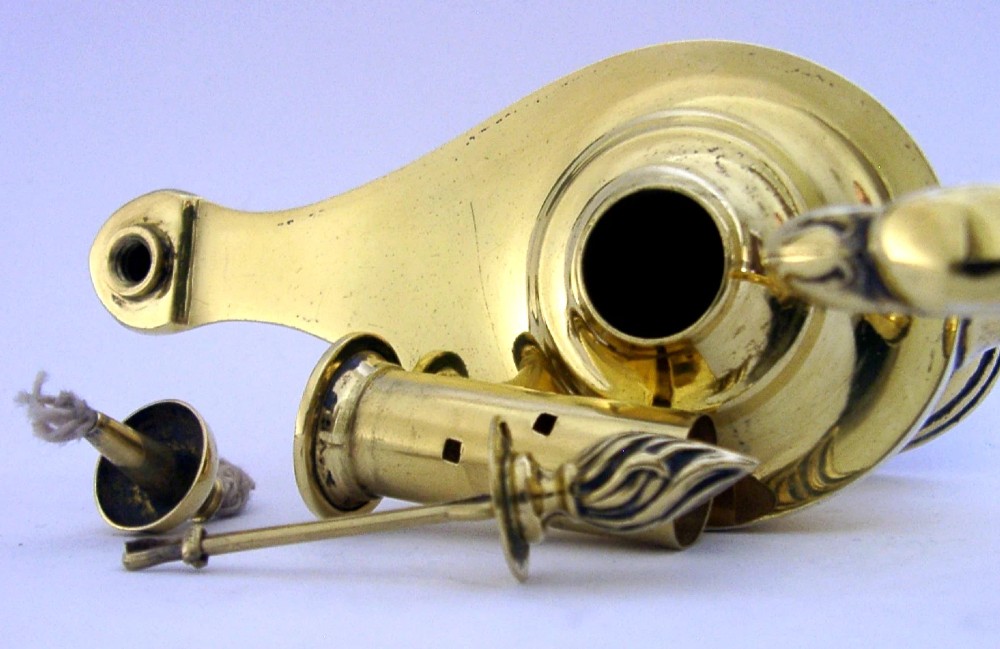 An antique Edwardian silver gilt cigar lighter crafted in the shape of a classical oil lamp with a serpent head handle and flame finial. View III
