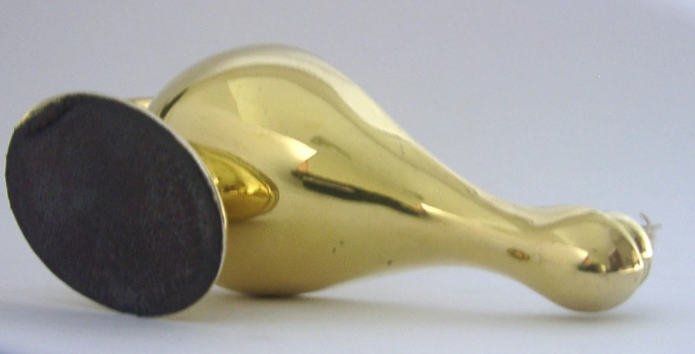 An antique Edwardian silver gilt cigar lighter crafted in the shape of a classical oil lamp with a serpent head handle and flame finial. View VI