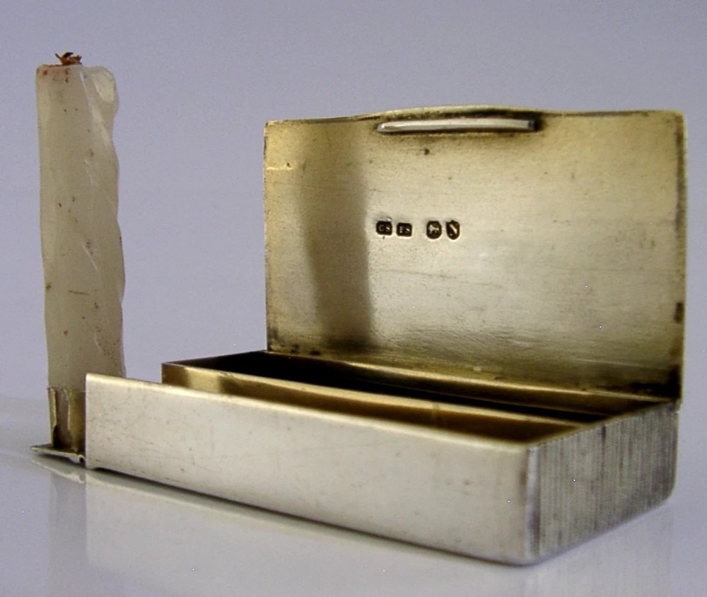 A Victorian sterling silver combination vesta case and go-to-bed taper holder with its hinged lid open. View III
