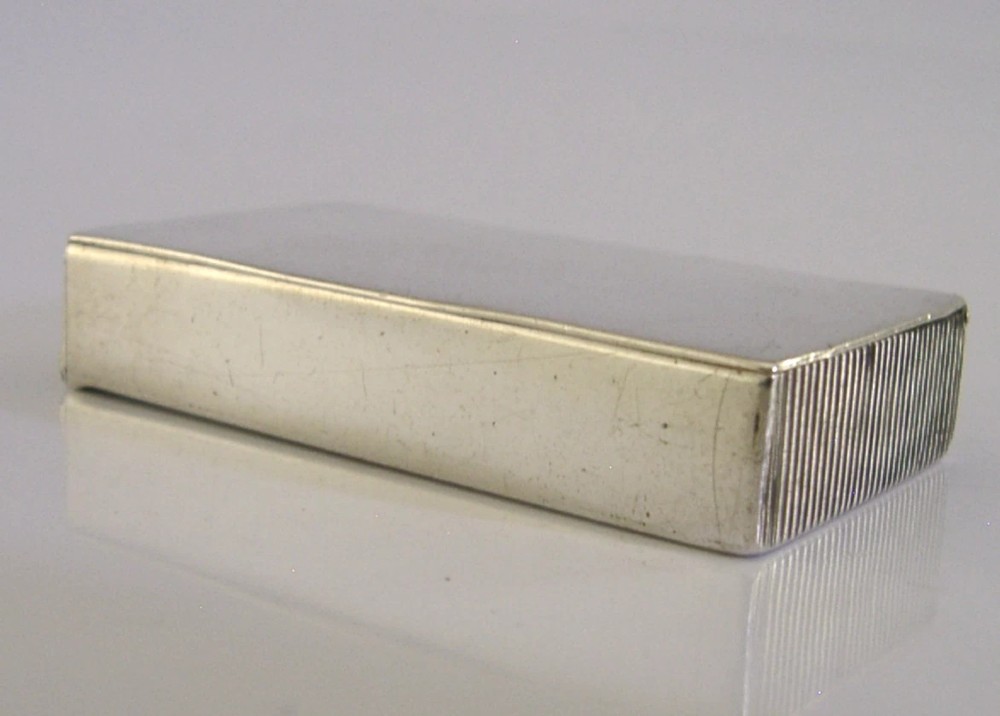 A Victorian sterling silver combination vesta case and go-to-bed taper holder with its hinged lid open. View VII