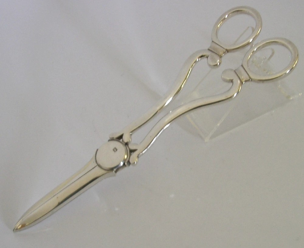 Antique Edwardian sterling silver grape shears presented inside an open, dark fitted case with a blue velvet and satin lining. View VII