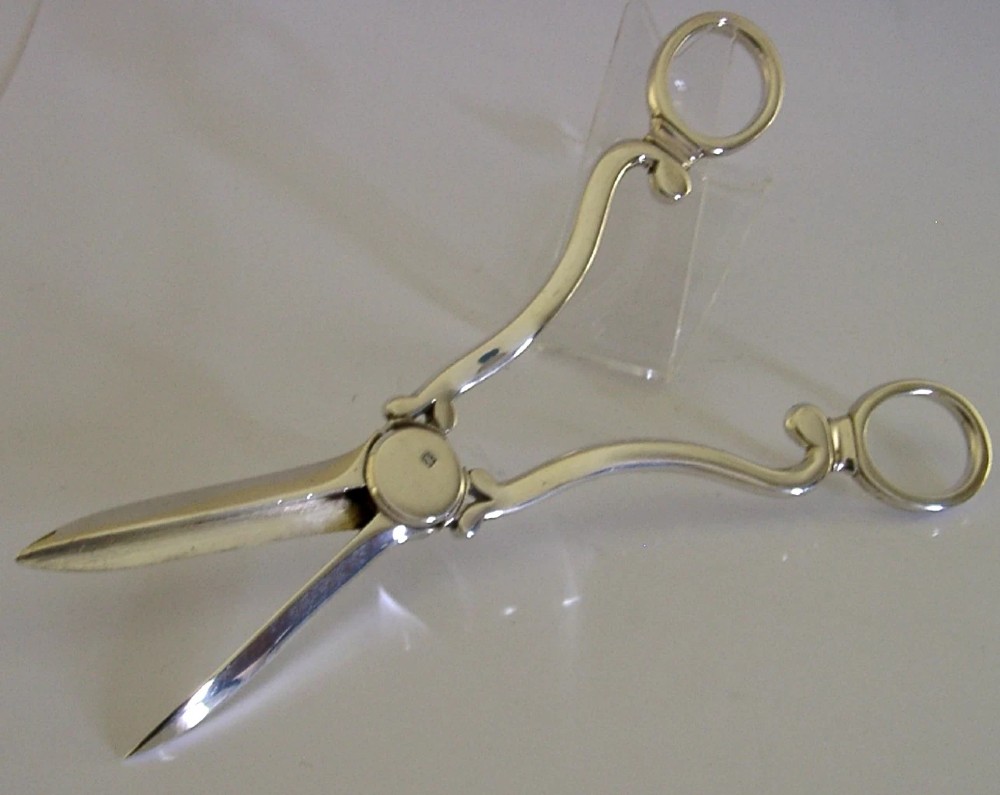 Antique Edwardian sterling silver grape shears presented inside an open, dark fitted case with a blue velvet and satin lining. View VIII