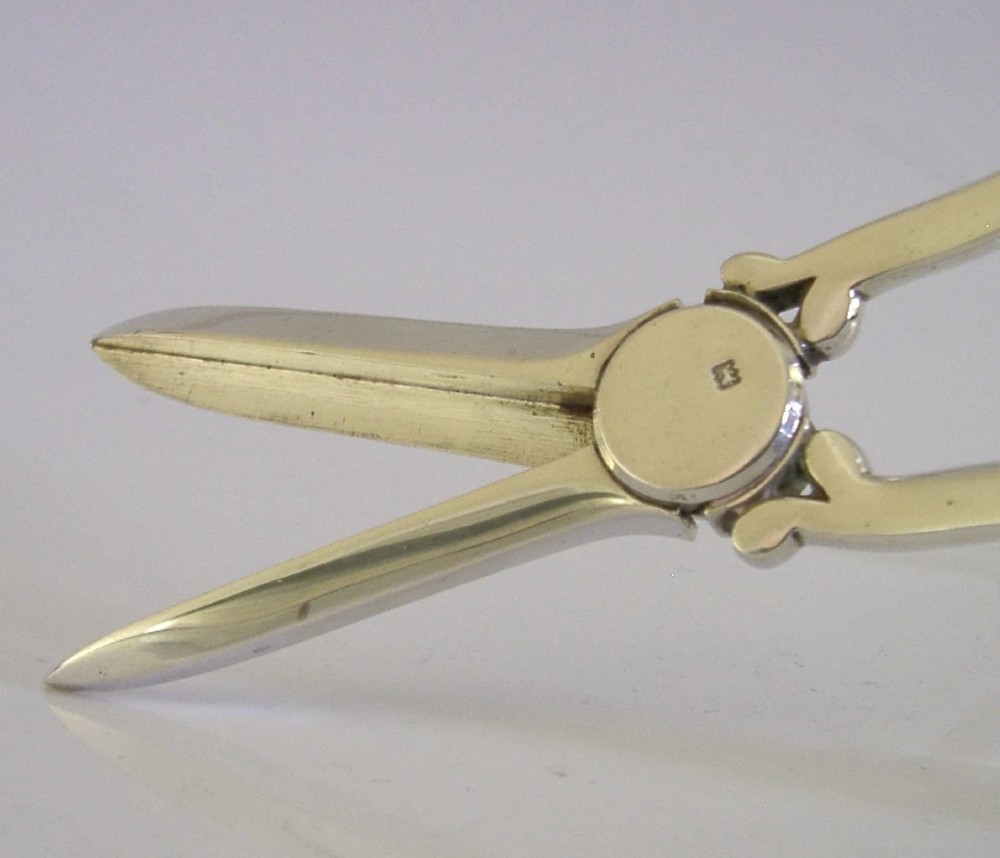 Antique Edwardian sterling silver grape shears presented inside an open, dark fitted case with a blue velvet and satin lining. View X
