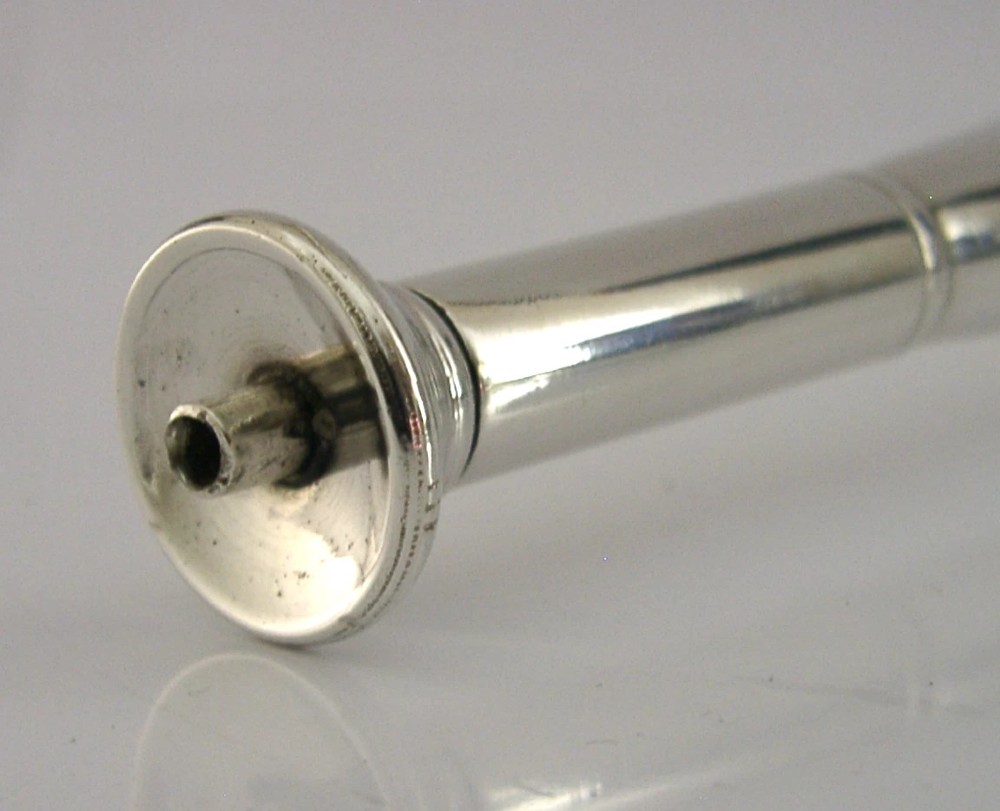 Victorian sterling silver table cigar lighter crafted in the shape of a flared fox hunting horn with British hallmarks visible near the base. View III