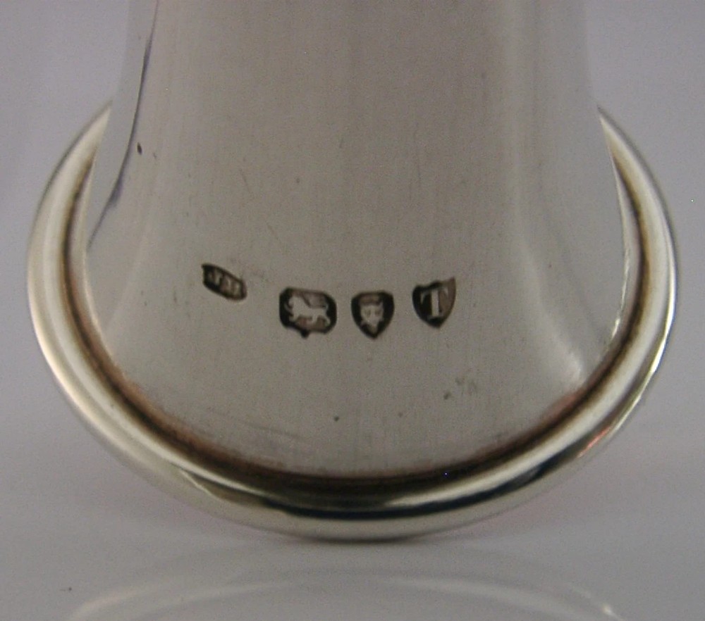 Victorian sterling silver table cigar lighter crafted in the shape of a flared fox hunting horn with British hallmarks visible near the base. View VII