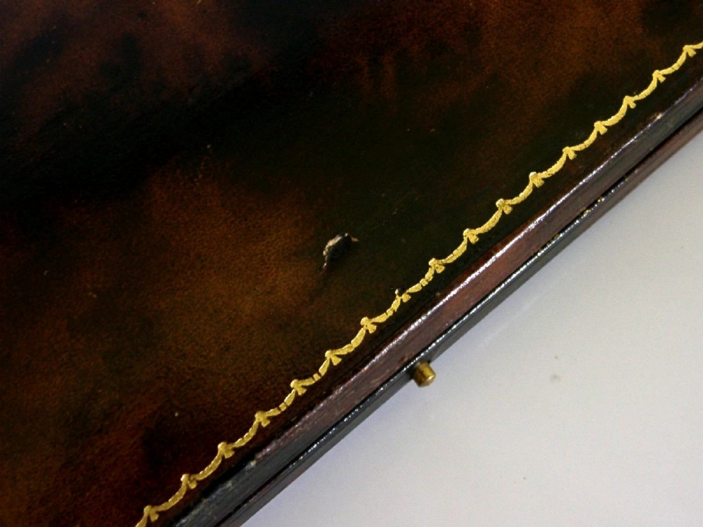 A pair of sterling silver horseshoe-shaped napkin rings presented inside a silk-lined leatherette presentation box. View VII