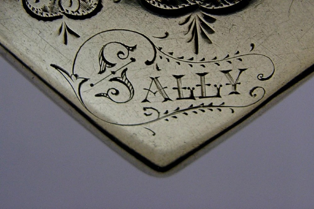 An engraved sterling silver Victorian vesta case featuring elaborate scrollwork detailing and the engraved name Sarah. View III
