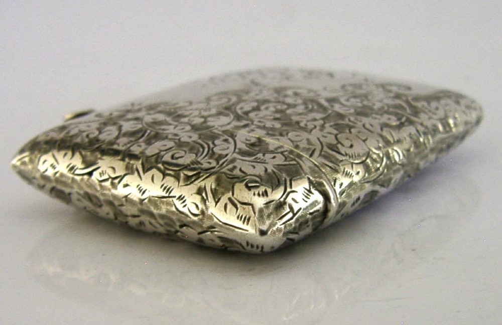 An engraved sterling silver Victorian vesta case featuring elaborate scrollwork detailing and the engraved name Sarah. View IX