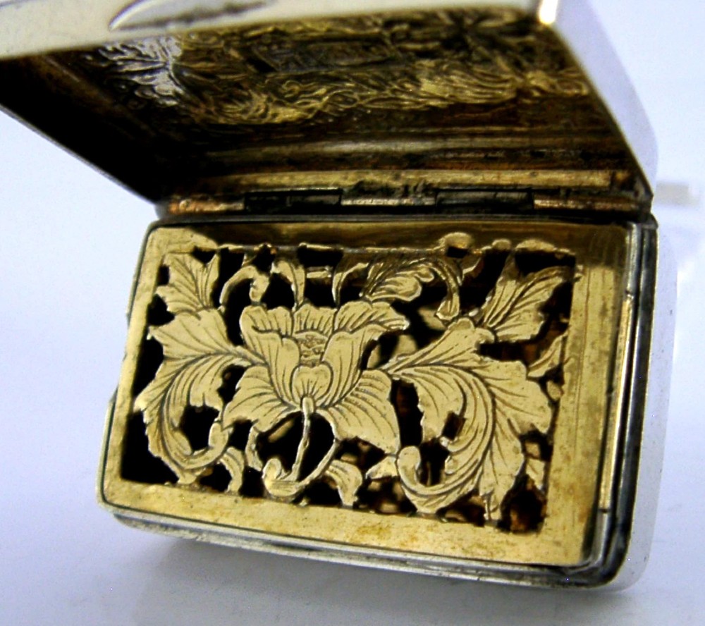 An open nineteenth-century rectangular Chinese export silver vinaigrette box showing a gilded interior with an intricately pierced floral grille. View II