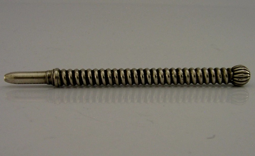 A Victorian sterling silver propelling pencil featuring a ribbed barrel design and a rounded fluted finial. View III