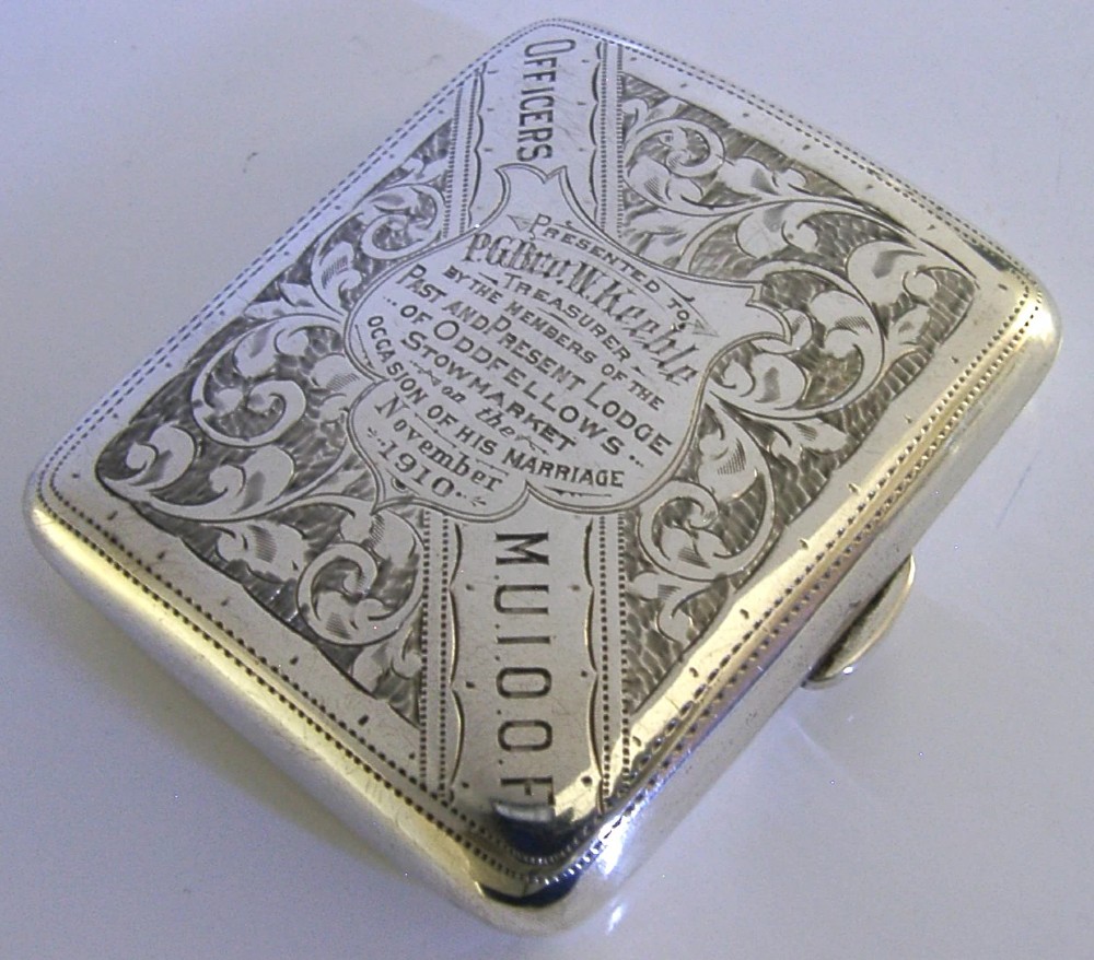 An engraved Edwardian sterling silver cigarette case featuring floral foliage and presentation text for the Independent Order of Oddfellows dated November 1910. View IV