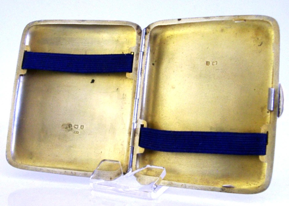 An engraved Edwardian sterling silver cigarette case featuring floral foliage and presentation text for the Independent Order of Oddfellows dated November 1910. View V