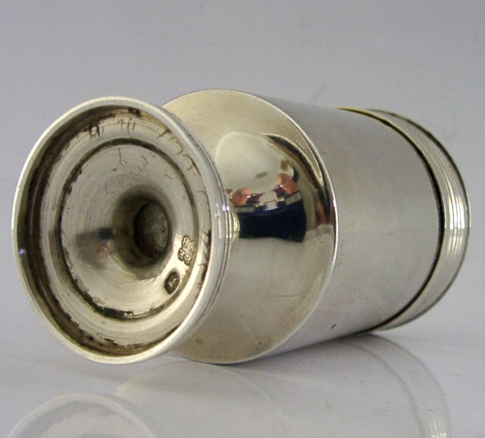 A Georgian sterling silver cylindrical caster top showing a hand-pierced dome with a gilded interior. View VII