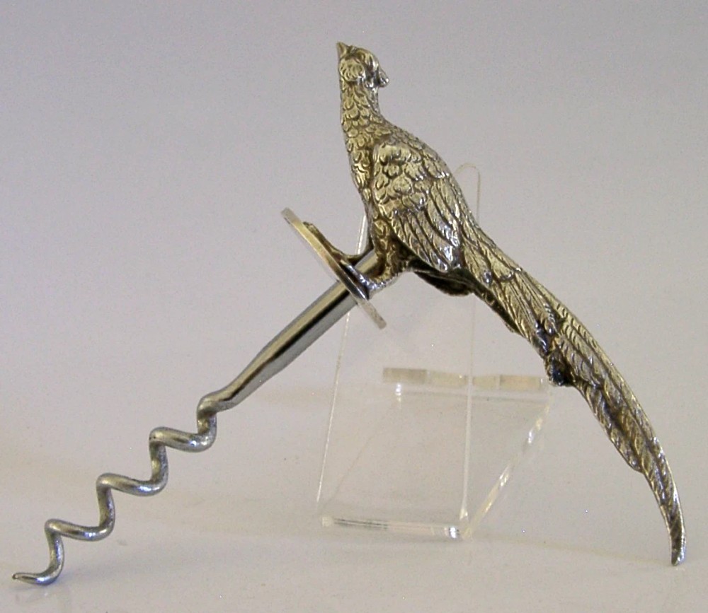 A sterling silver corkscrew featuring a sculpted handle in the shape of a pheasant in flight attached to a steel worm. View III