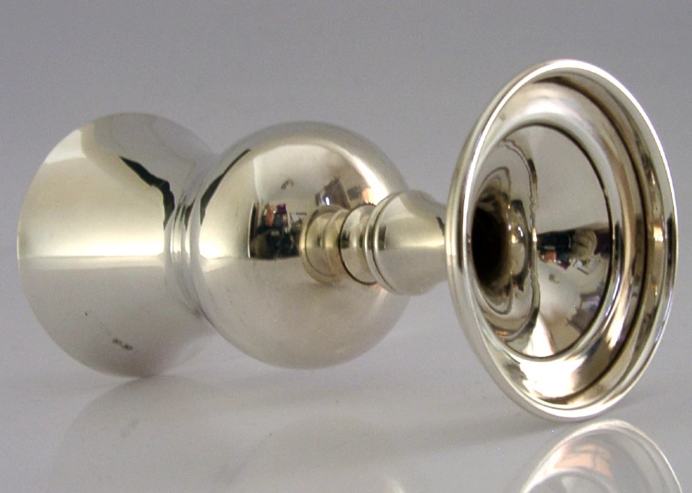 A sterling silver wine goblet featuring a bulbous bowl with a flared rim, a gilt interior, a short turned stem, and a stepped circular foot. View VII