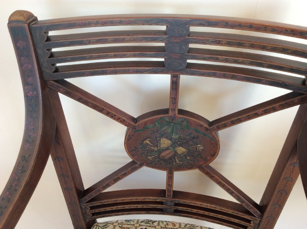 A Georgian open elbow chair with dark wood frame featuring hand-painted floral and musical motifs, an X-shaped back splat with central roundel, and a floral patterned upholstered seat. View II
