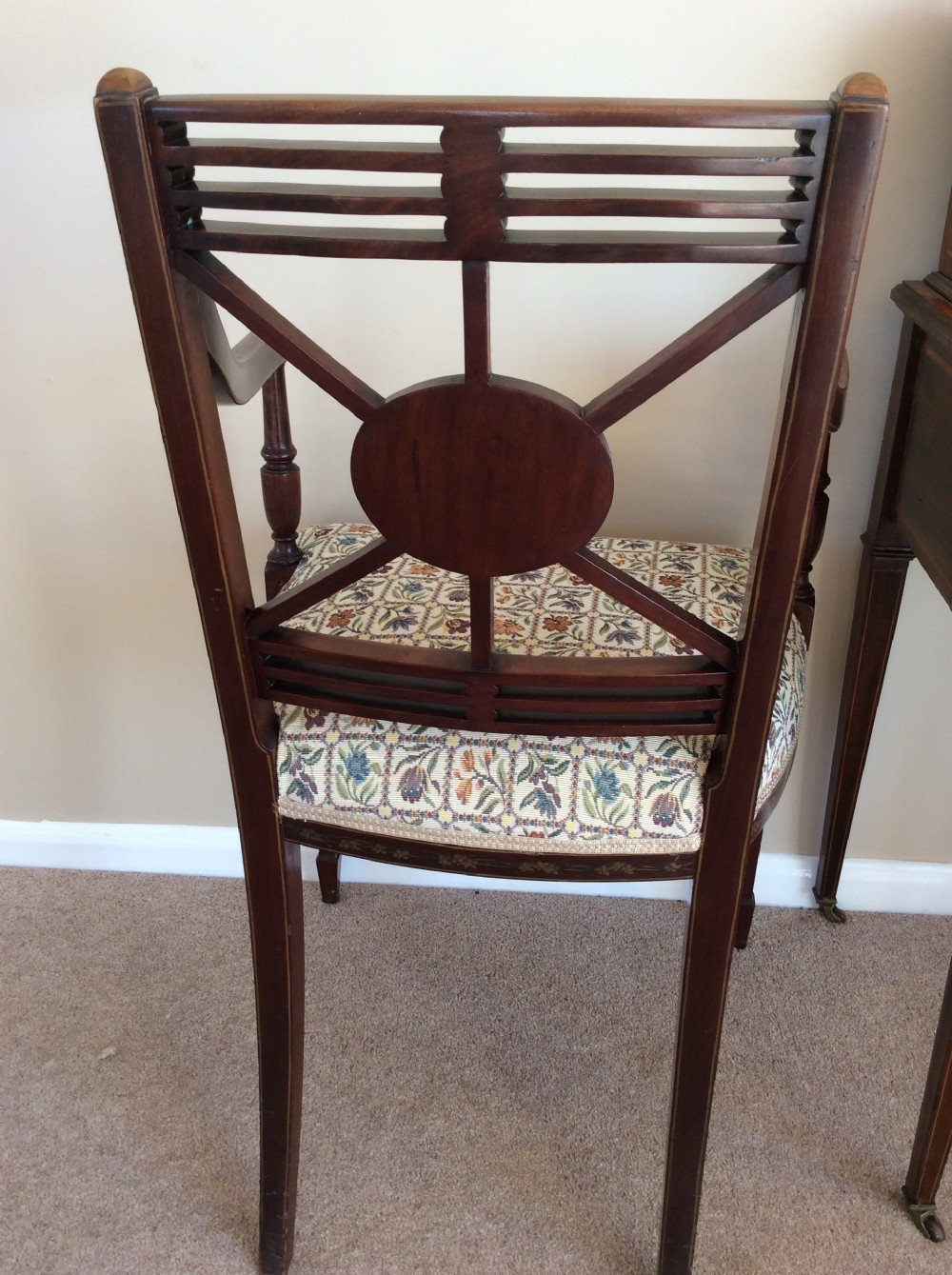 A Georgian open elbow chair with dark wood frame featuring hand-painted floral and musical motifs, an X-shaped back splat with central roundel, and a floral patterned upholstered seat. View IX