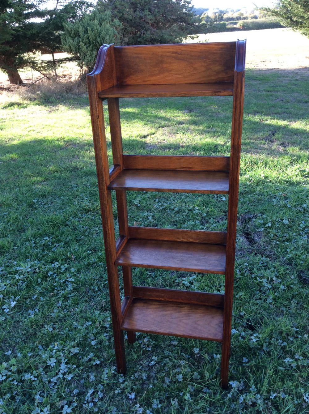 Oak open bookcase complete with set of Charles Dickens novels View II