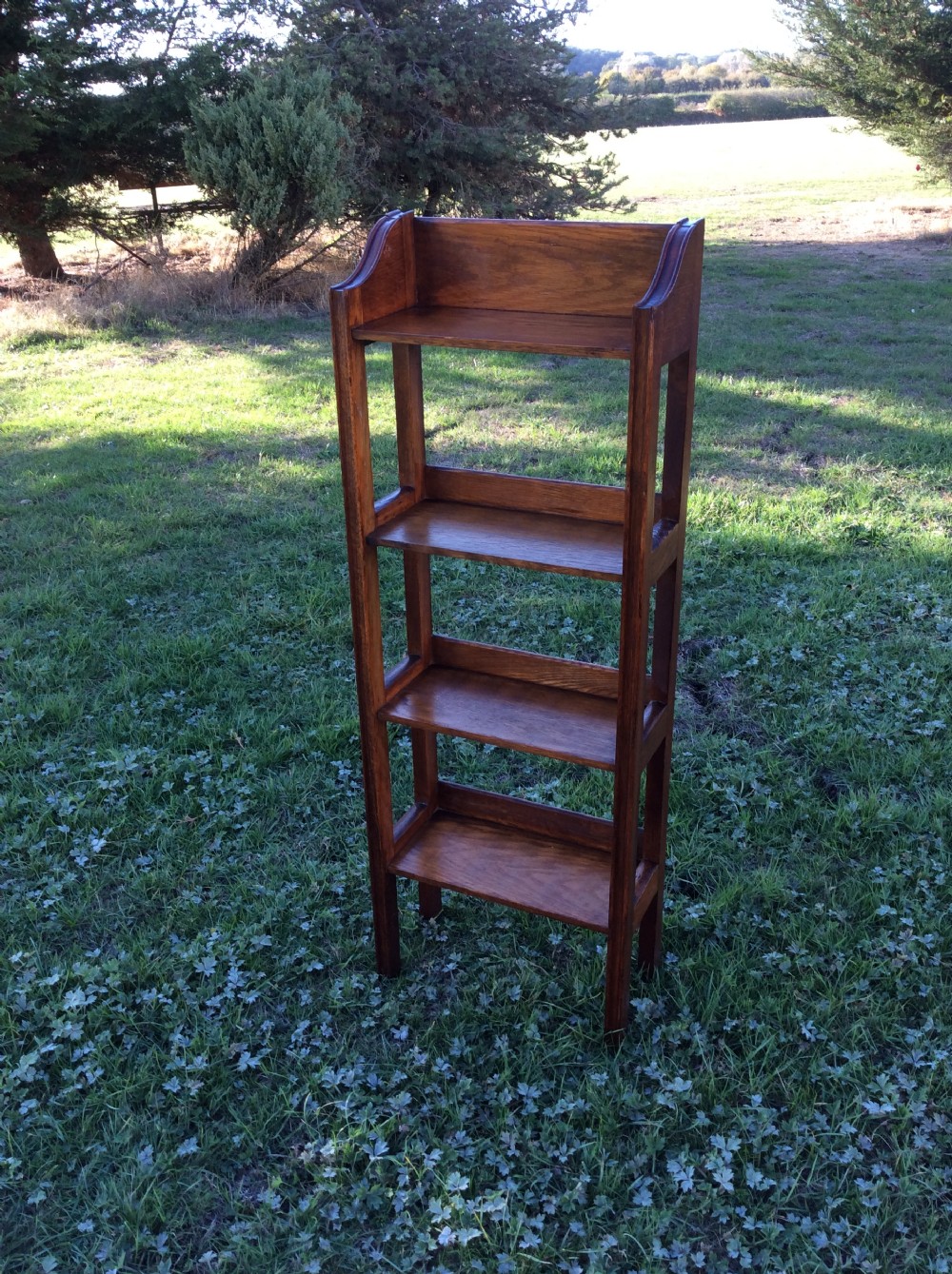 Oak open bookcase complete with set of Charles Dickens novels View III