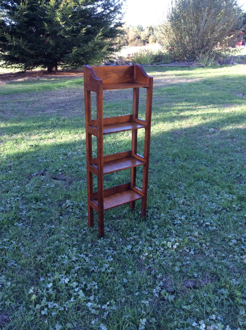Oak open bookcase complete with set of Charles Dickens novels View V