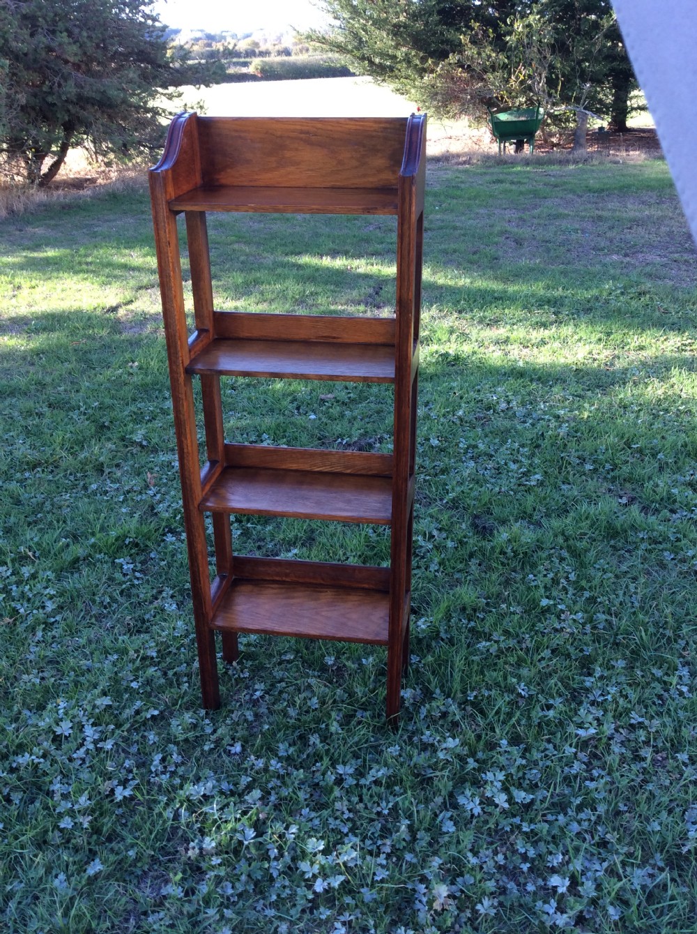 Oak open bookcase complete with set of Charles Dickens novels View IX