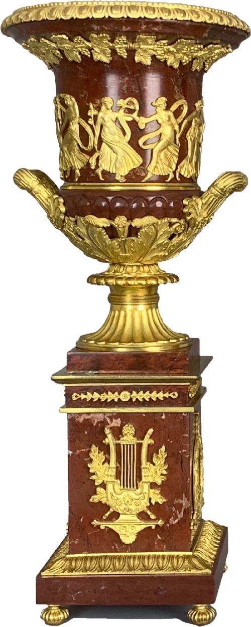A pair of French Empire style red marble urns featuring gilded bronze classical figure reliefs and mounted on square marble pedestals with lyre details. View VII
