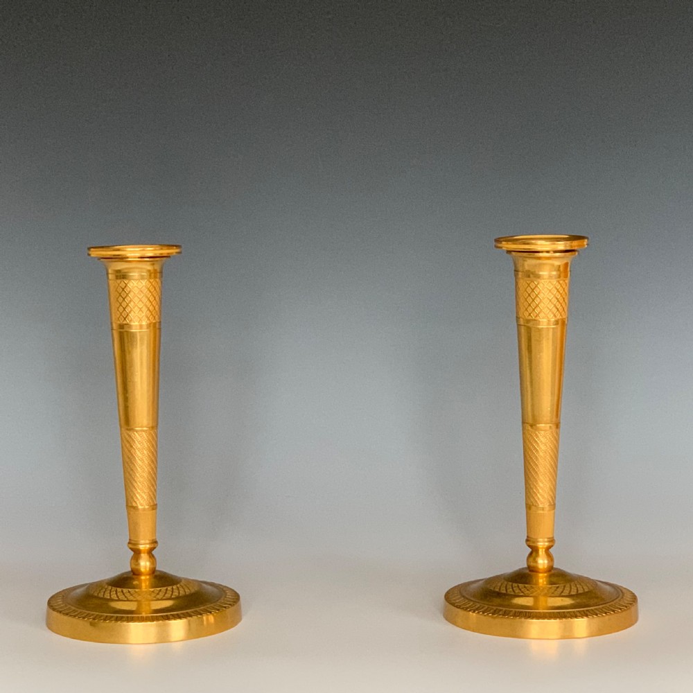 A Pair of French Empire Ormolu Bronze Candlesticks