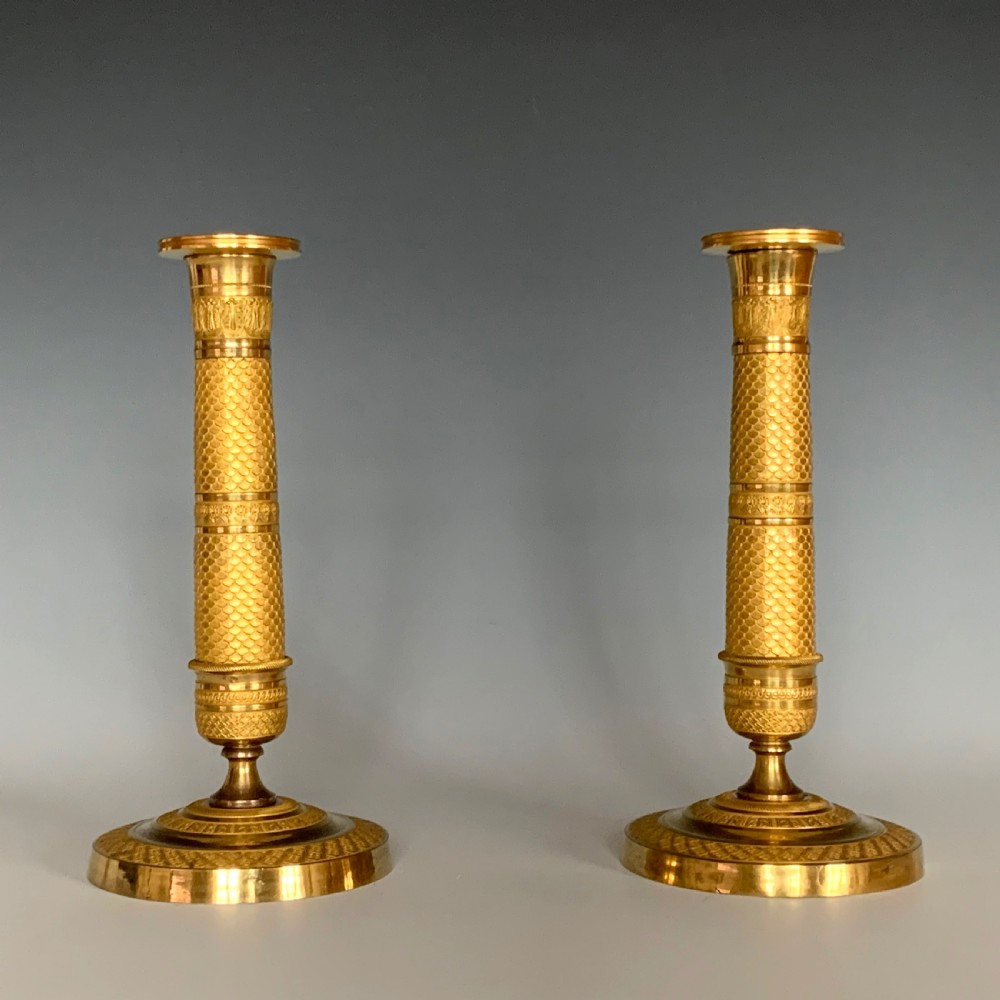 A Pair of French Empire Gilt Bronze Candlesticks