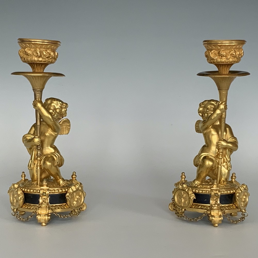 A Pair of Antique Victorian Ormolu Cherub Candlesticks View II