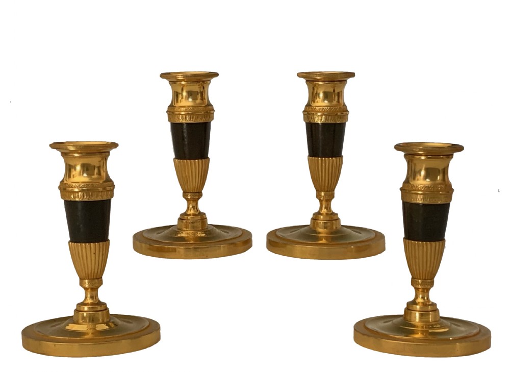 Four George IV Regency Ormolu Candlesticks