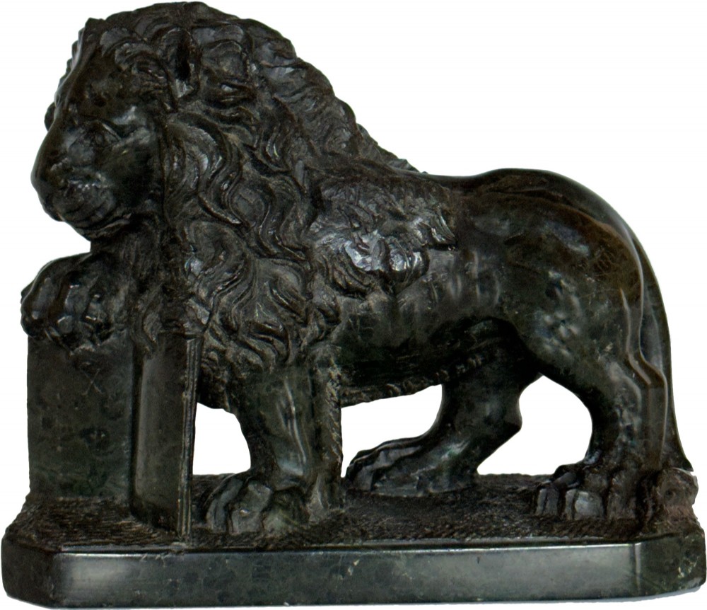 A dark green carved serpentine marble sculpture depicting the Lion of Saint Mark resting a paw on an upright book. View V
