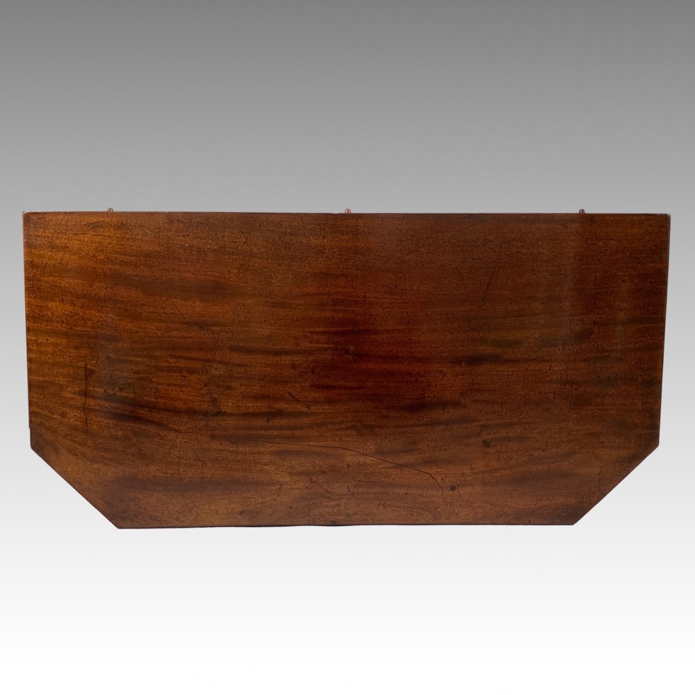 A George IV mahogany fold-over card table featuring a turned pedestal stem, geometric frieze inlay, and splayed legs with brass paw castors. View IX