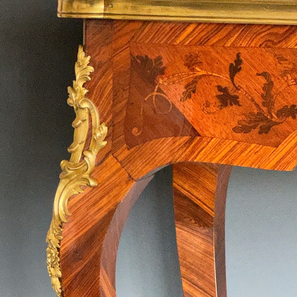 A French Louis XV style kingwood side table featuring floral marquetry inlay, slender cabriole legs, and ornate gilt bronze mounts. View II