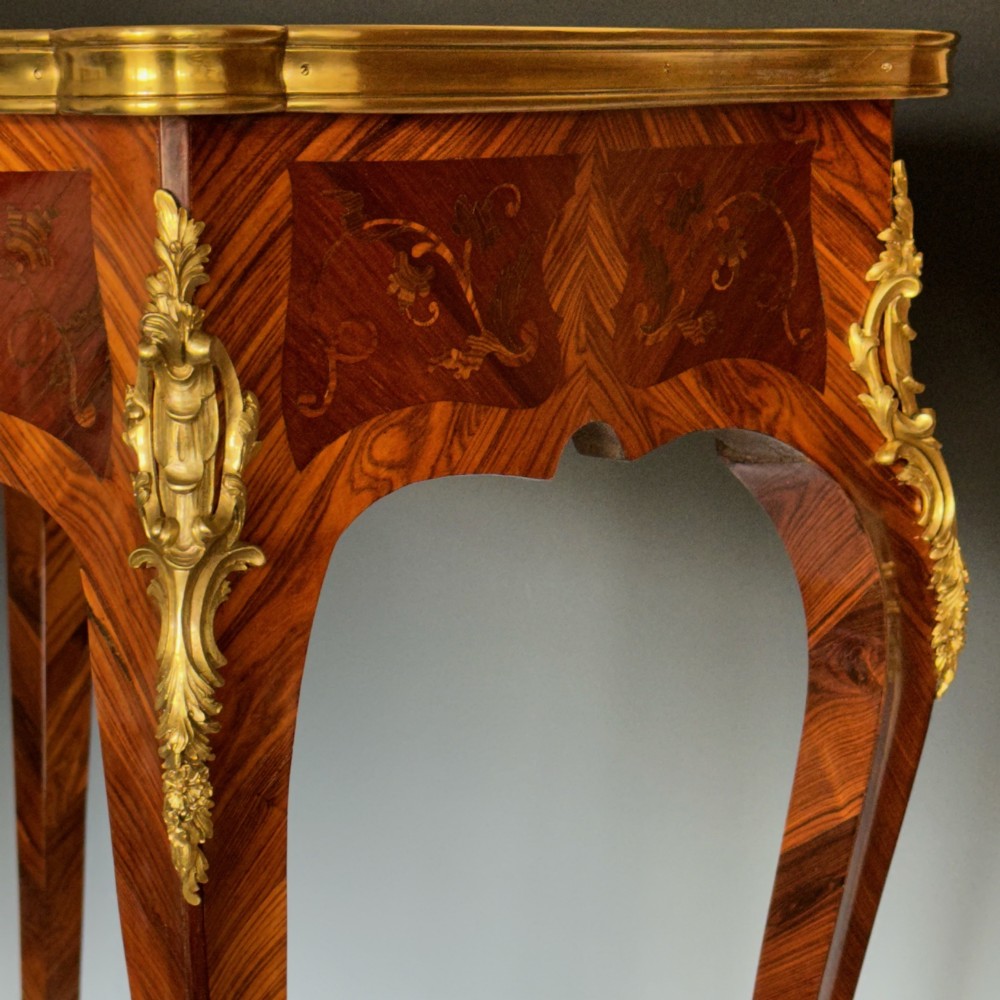 A French Louis XV style kingwood side table featuring floral marquetry inlay, slender cabriole legs, and ornate gilt bronze mounts. View III