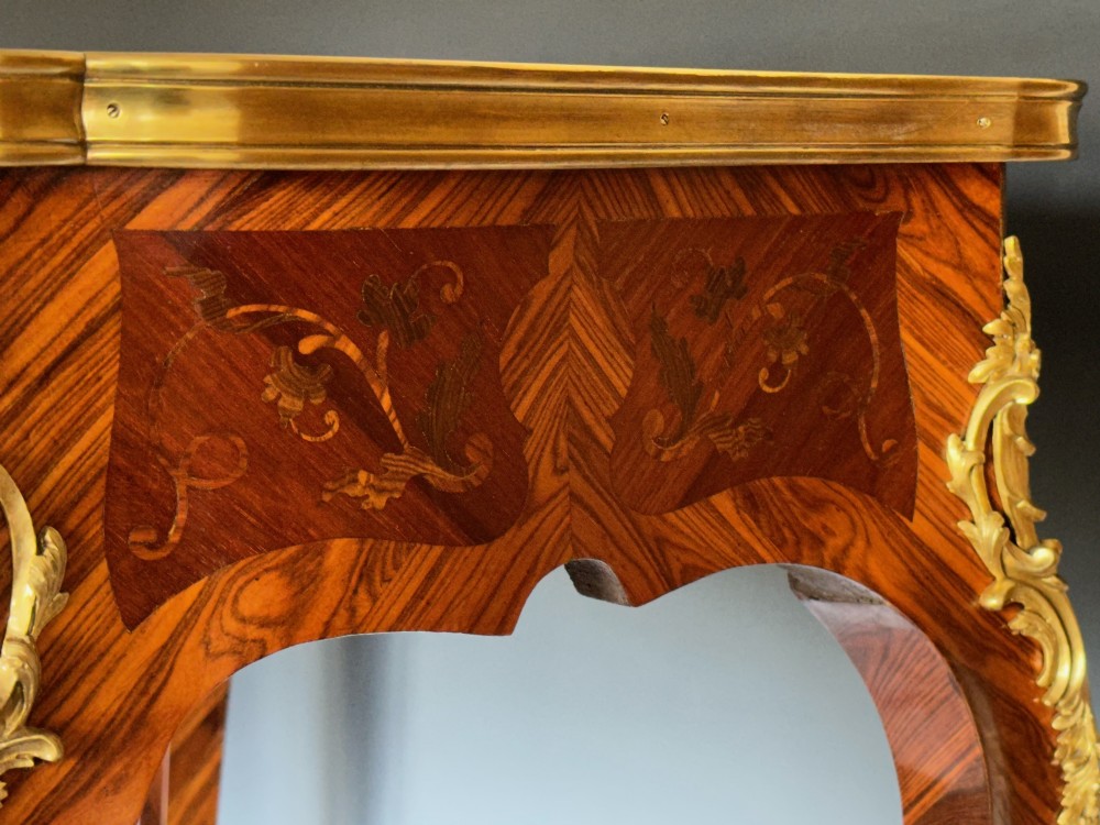 A French Louis XV style kingwood side table featuring floral marquetry inlay, slender cabriole legs, and ornate gilt bronze mounts. View V