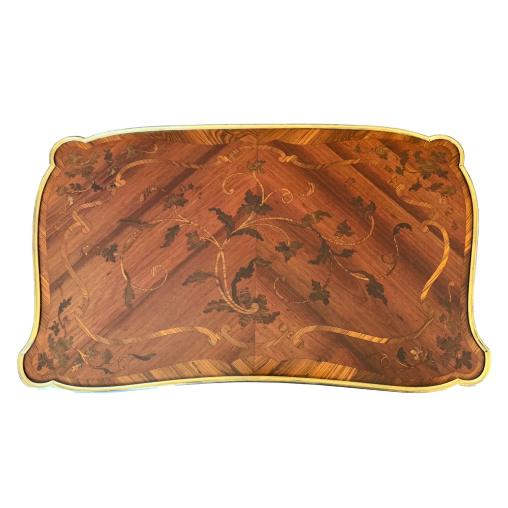 A French Louis XV style kingwood side table featuring floral marquetry inlay, slender cabriole legs, and ornate gilt bronze mounts. View VII