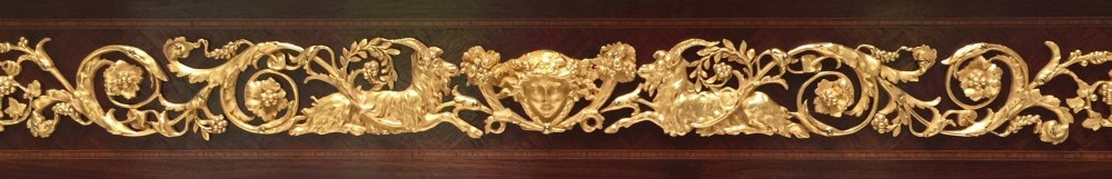 A rectangular Louis XVI style centre table featuring a variegated marble top, dark mahogany frieze with elaborate gilt bronze mounts, and four fluted tapered legs. View V