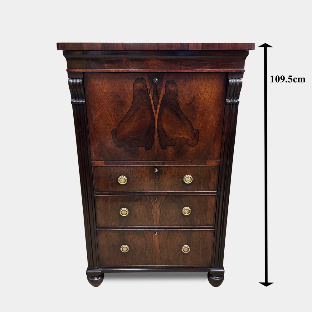 A George IV rosewood writing cabinet with a open fall-front desk revealing internal drawers and a dark green leather writing surface above lower drawers with brass handles. View IX