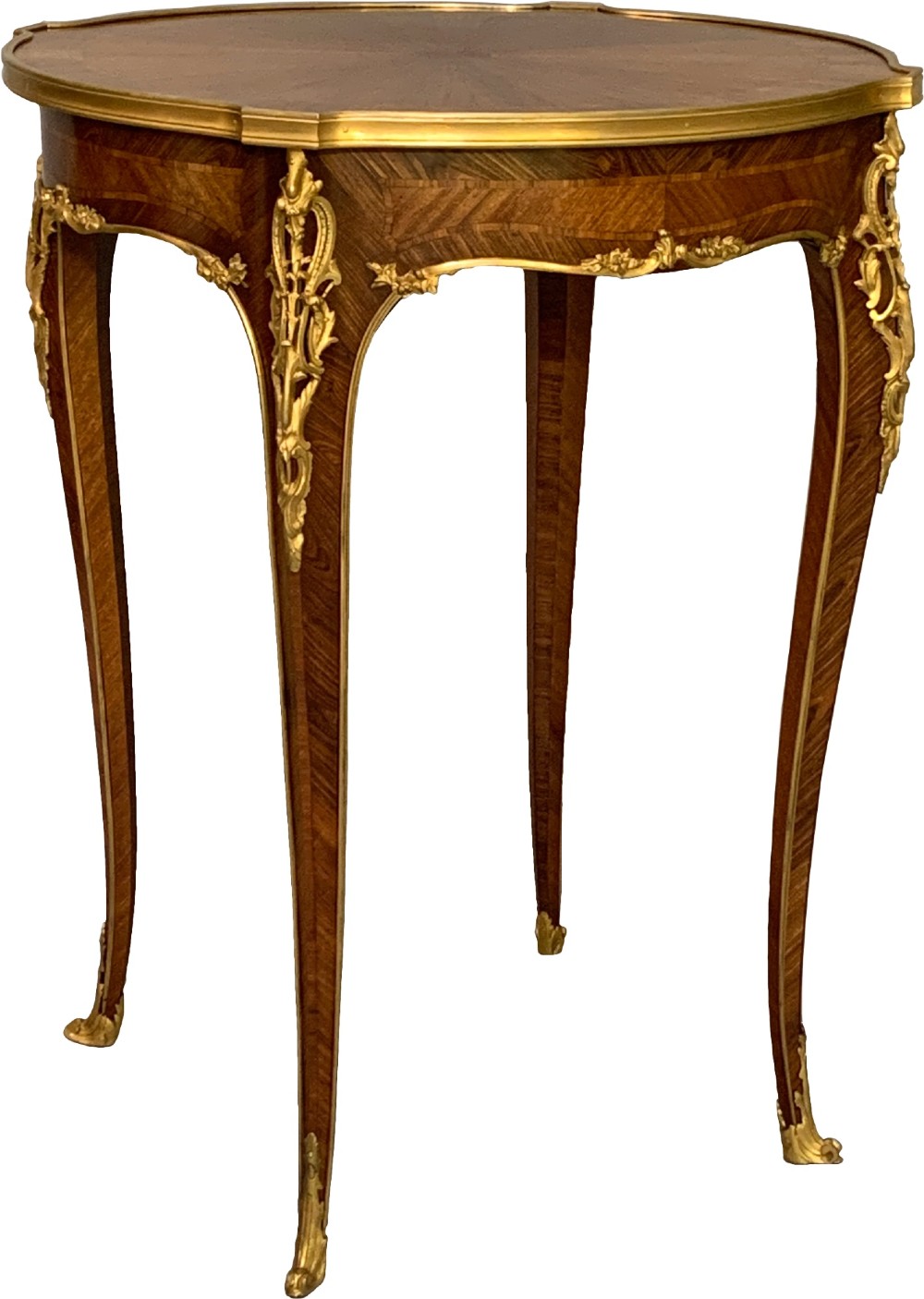A nineteenth-century French kingwood occasional table featuring quarter-veneered parquetry, slender cabriole legs, and decorative gilt-bronze mounts. View II