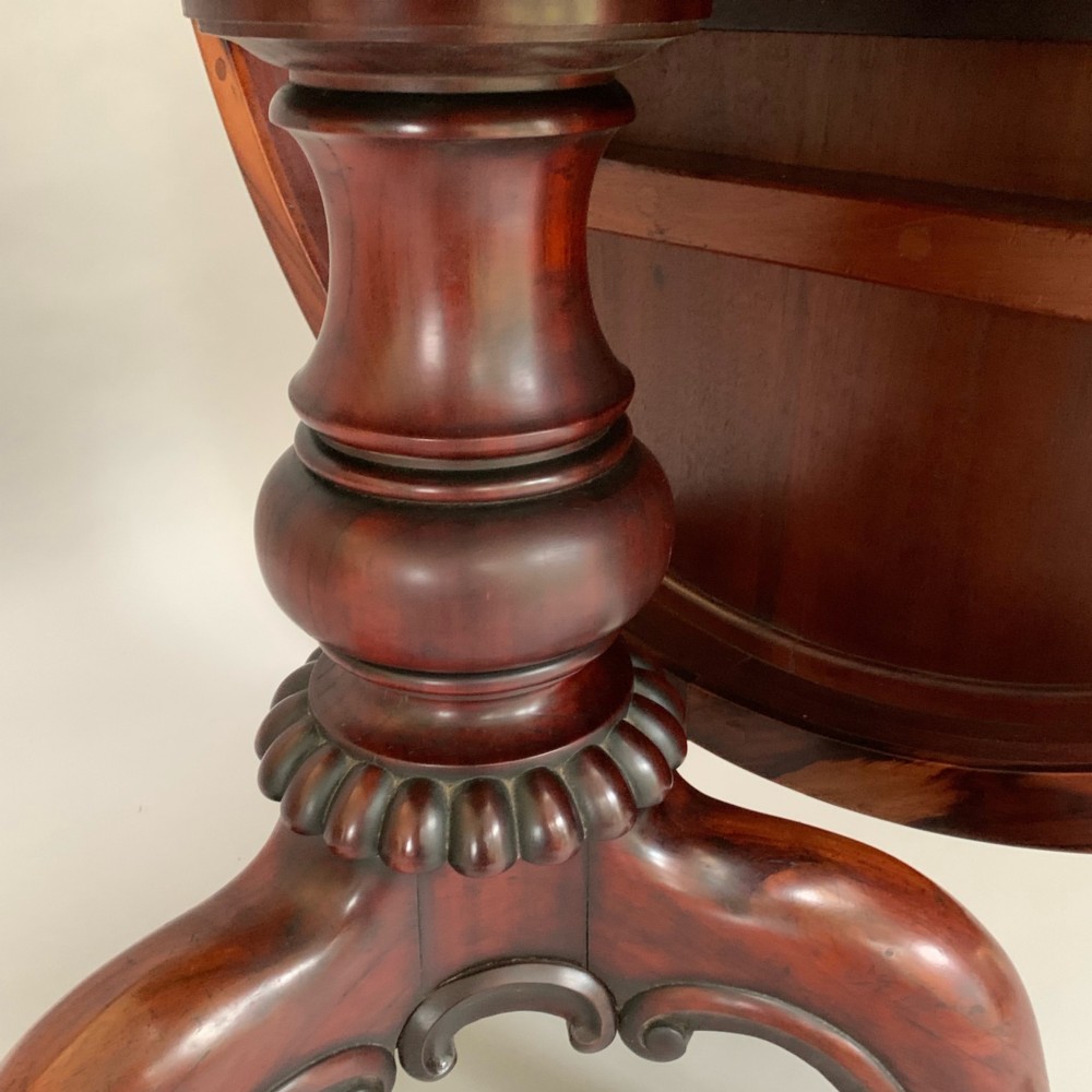 A 19th-century William IV oval centre table constructed from figured albuera wood with a gadrooned rim and a turned pedestal base. View III