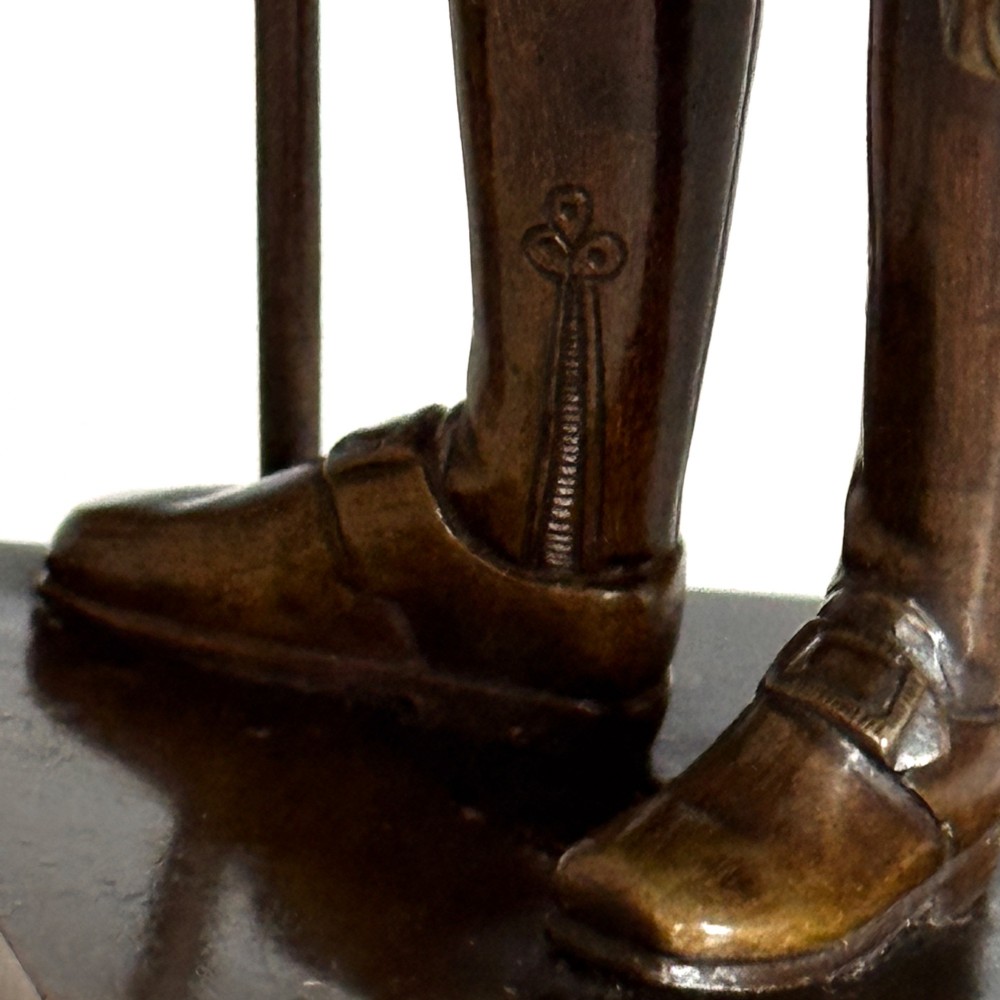 A pair of 19th-century French Restauration period patinated bronze statues of Voltaire and Rousseau mounted on yellow marble bases. View XII