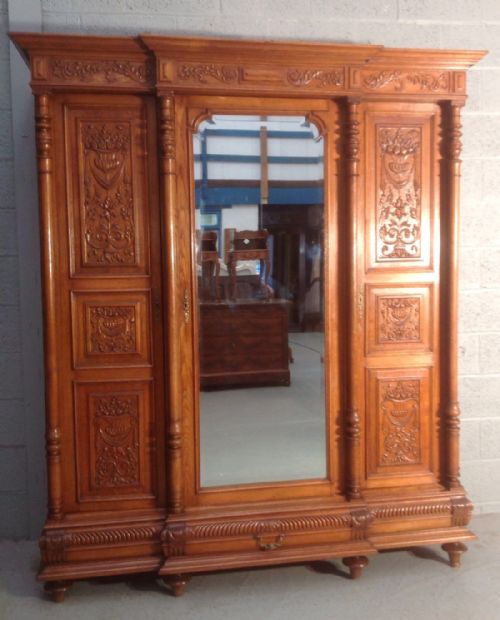 CARVED FRENCH OAK BREAKFRONT ARMOIRE - ADDITIONAL PHOTO 1