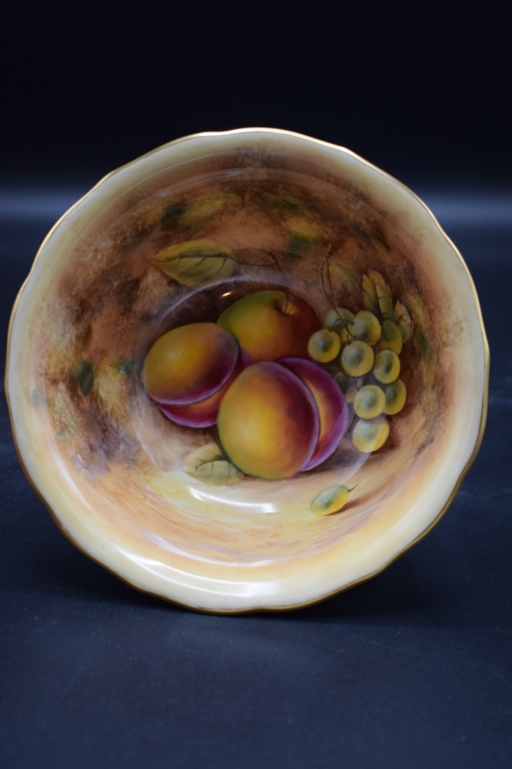 A pair of circular porcelain bowls featuring hand-painted peaches and grapes with gilded rims. View III