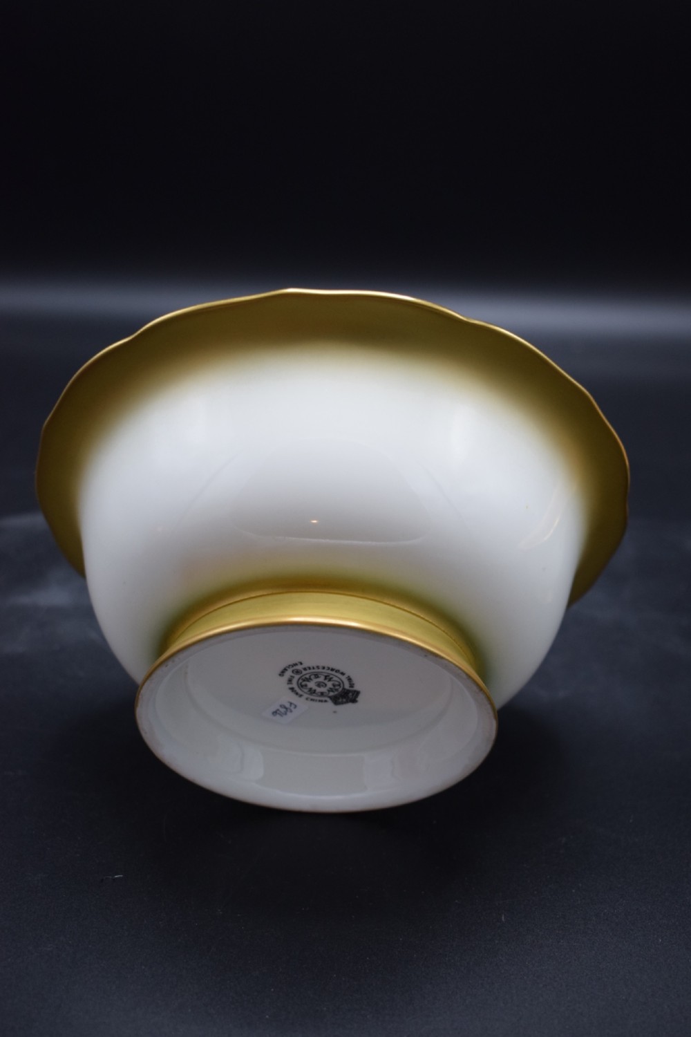 A pair of circular porcelain bowls featuring hand-painted peaches and grapes with gilded rims. View V